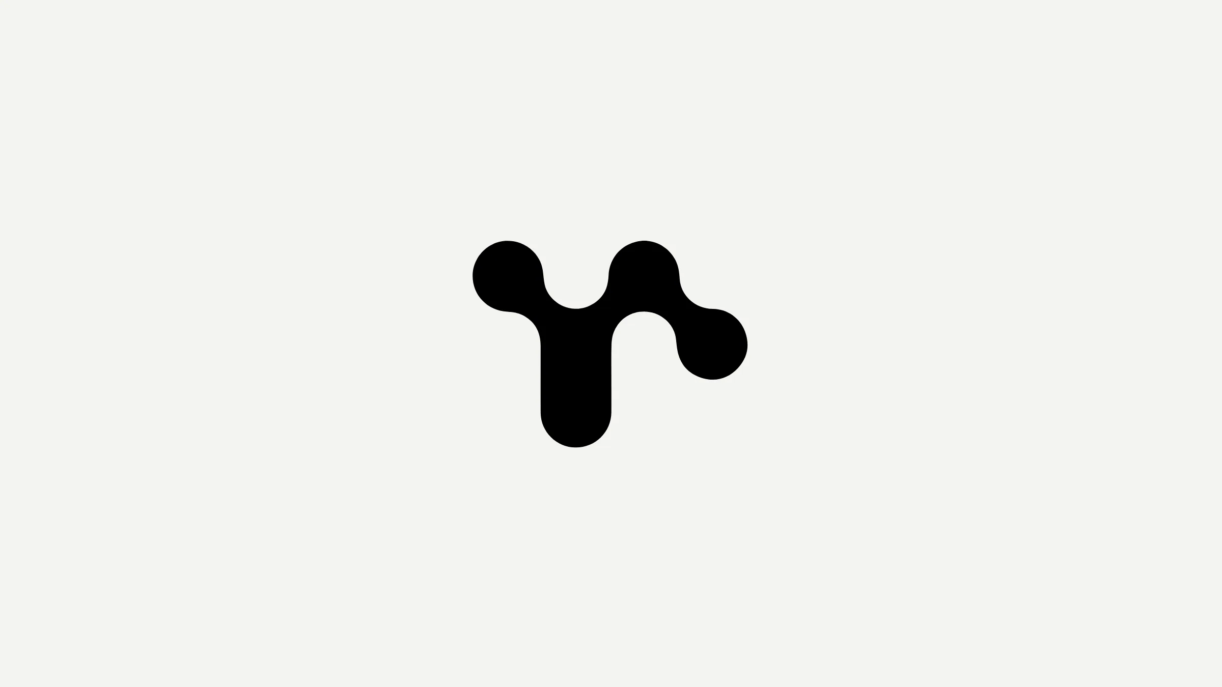 The Ekstrakt symbol in black on off-white
