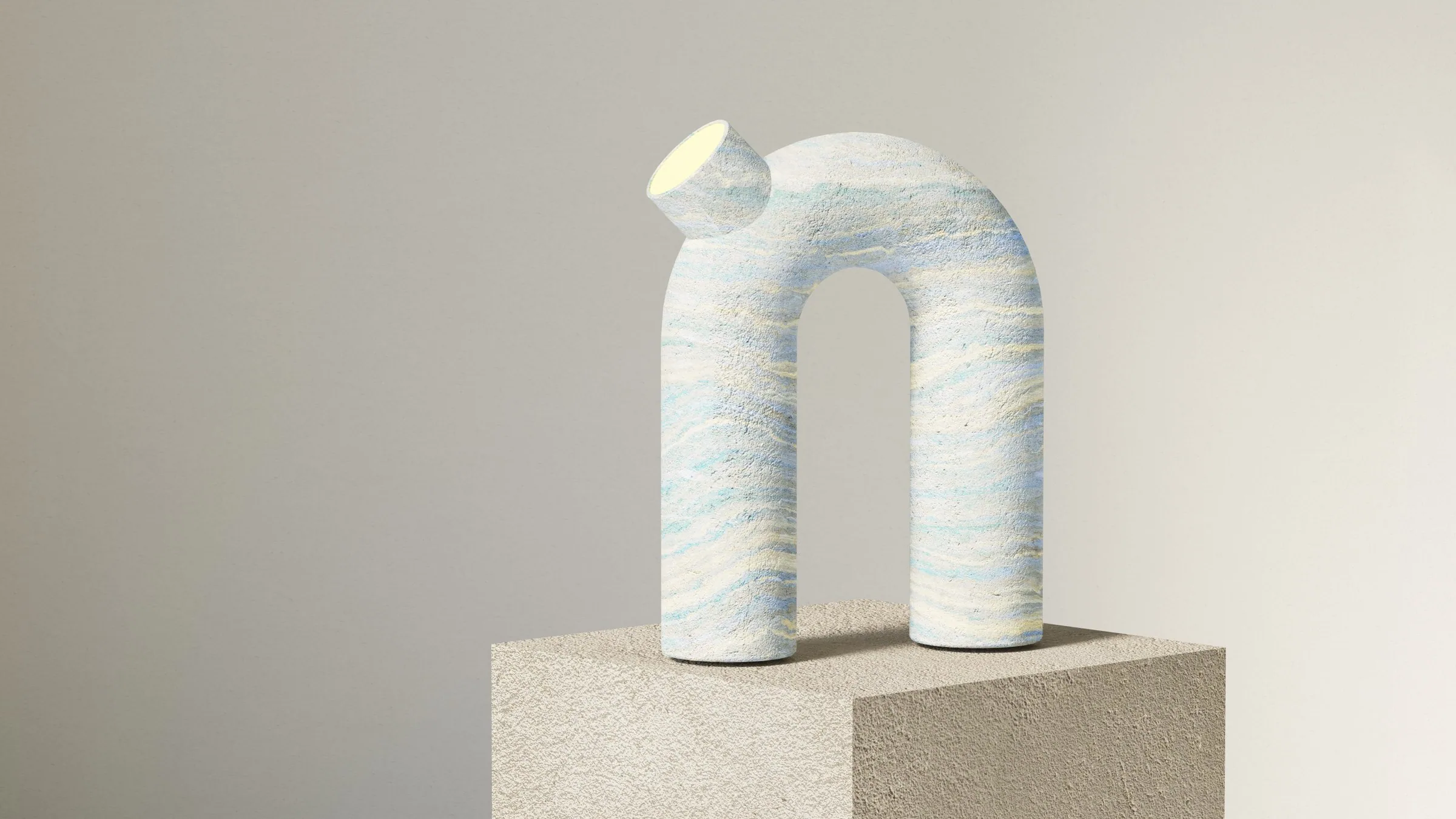 The arch lamp in blue and white layered stone, seen at an angle