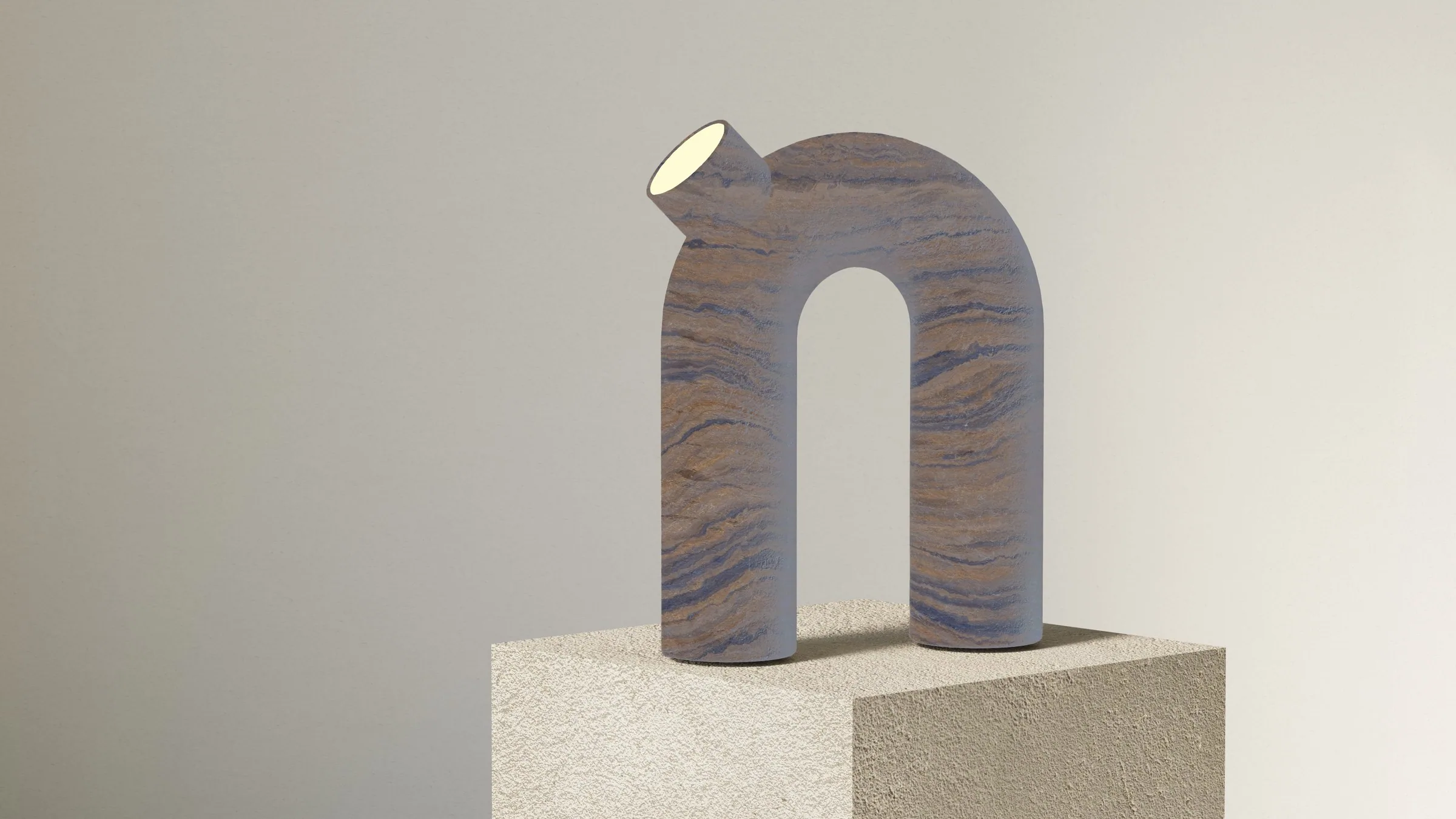 The arch lamp in dark blue-brown layered stone, seen at an angle