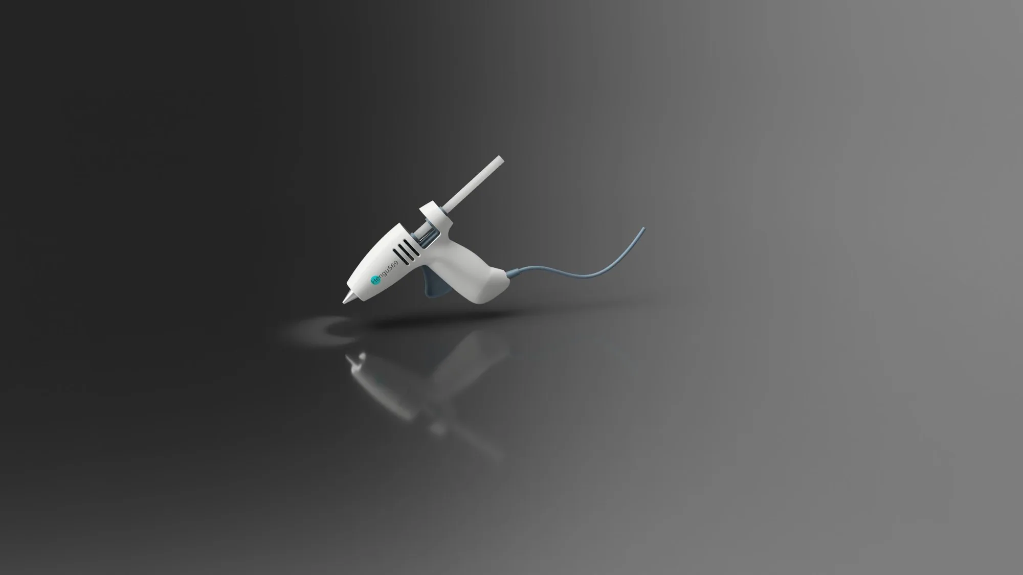 The glue gun floating above a dark grey studio floor with its reflection