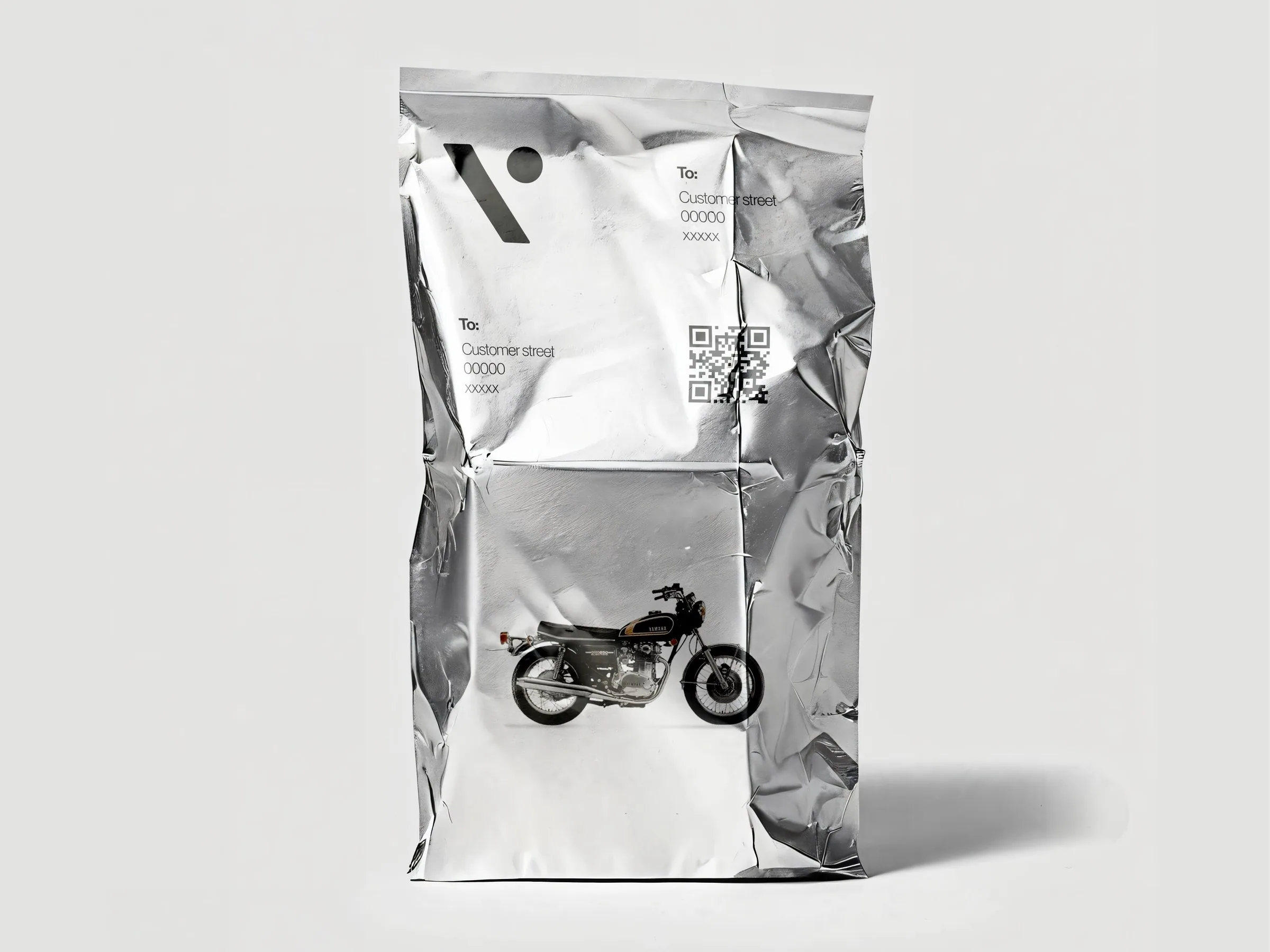 Silver mailer bag with the Vossa mark, address fields and a QR code