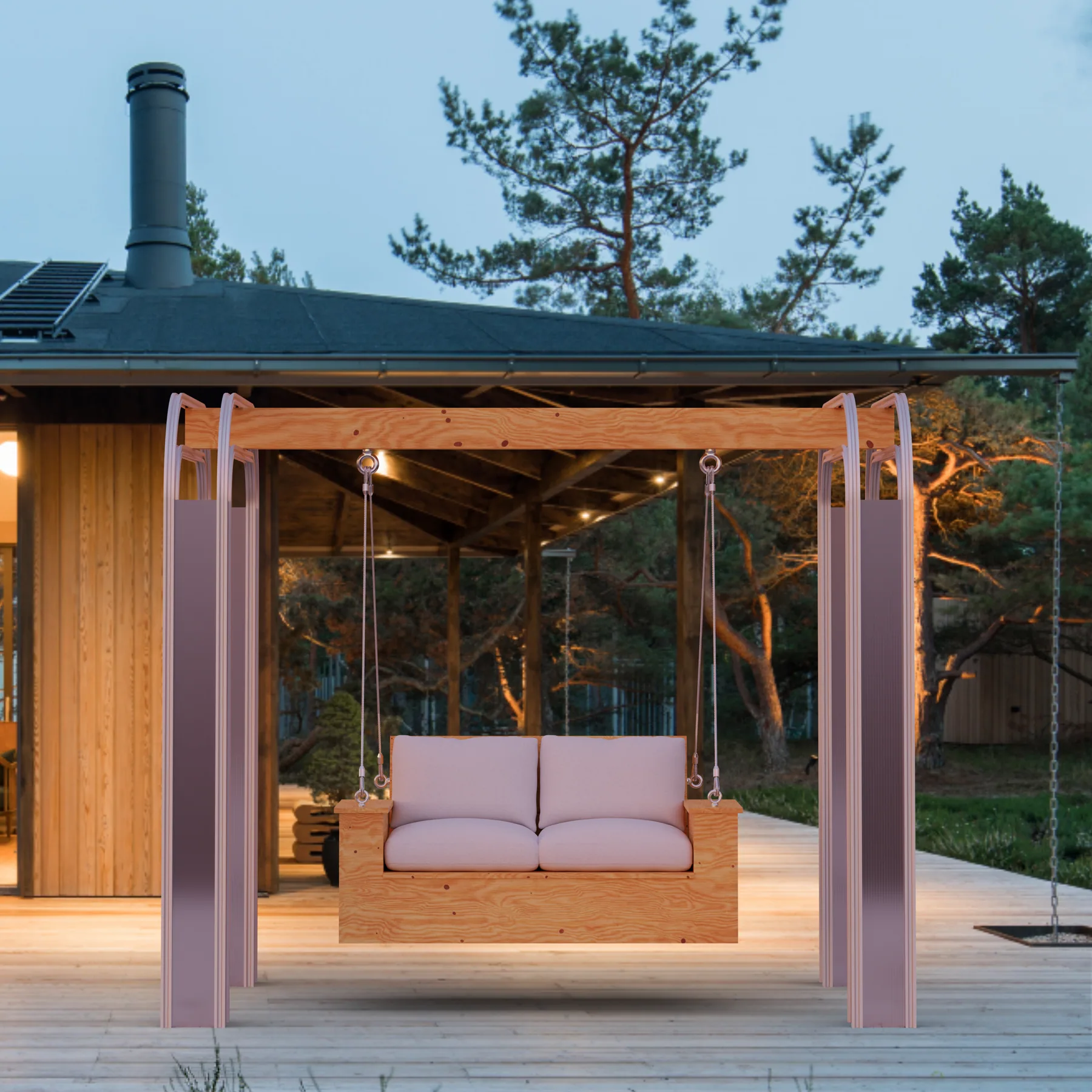 The swing standing on the wooden deck in front of the house at dusk